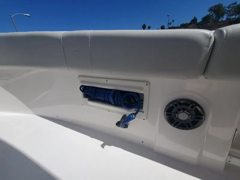Slide: The Image of Sea Fox 268 Commander 2022 boat interior with coiled hose and speaker. - 22