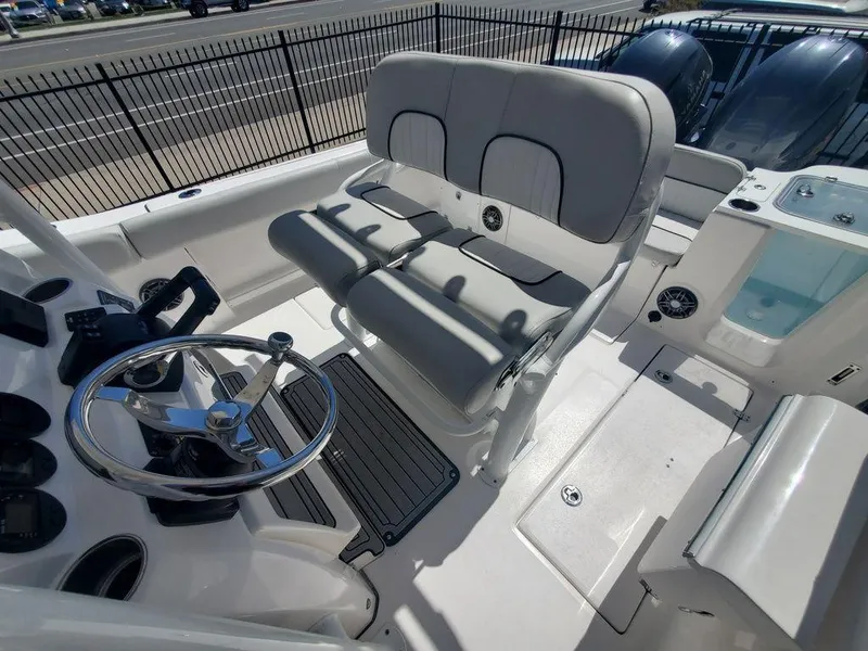 Slide: The Image of 2022 Sea Fox 268 Commander boat interior with dual seating and steering wheel. - 24