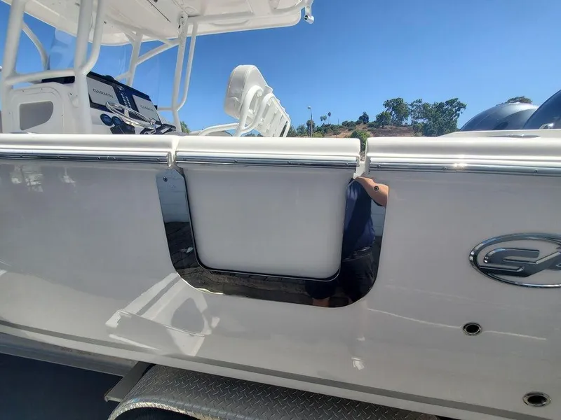 Slide: The Image of 2022 Sea Fox 268 Commander boat side view with sleek design and modern features. - 25