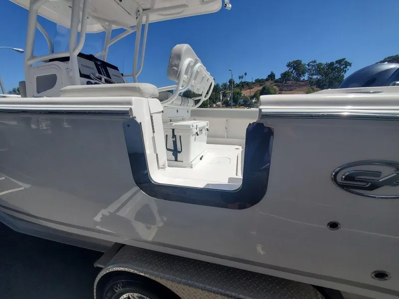 Slide: The Image of 2022 Sea Fox 268 Commander boat side view with seating and console. - 26