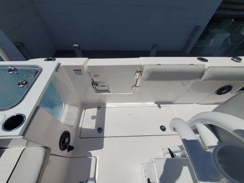 Slide: The Image of 2022 Sea Fox 268 Commander boat interior, featuring seating and storage compartments. - 28