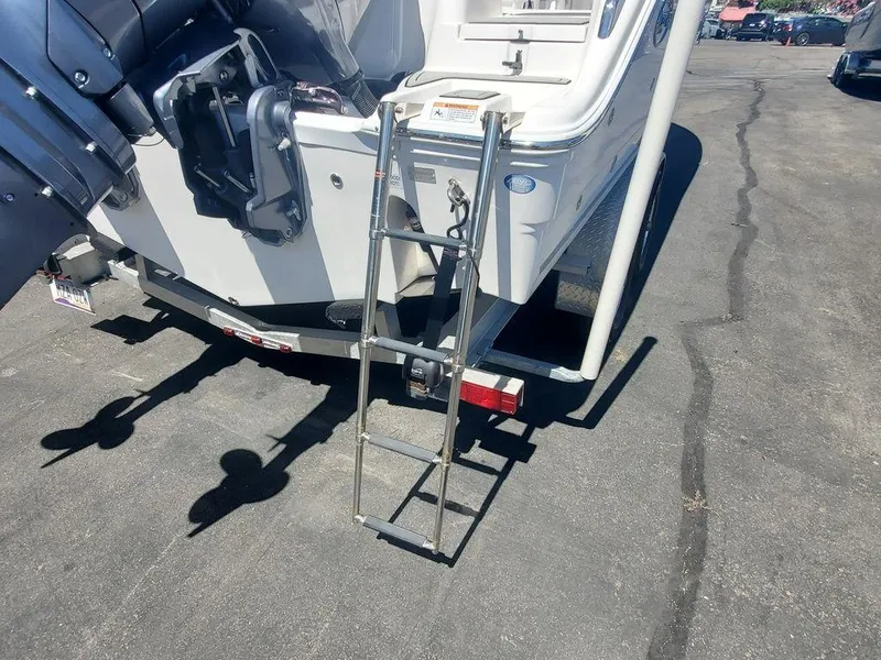 Slide: The Image of 2022 Sea Fox 268 Commander boat with ladder and motor, parked on asphalt. - 32