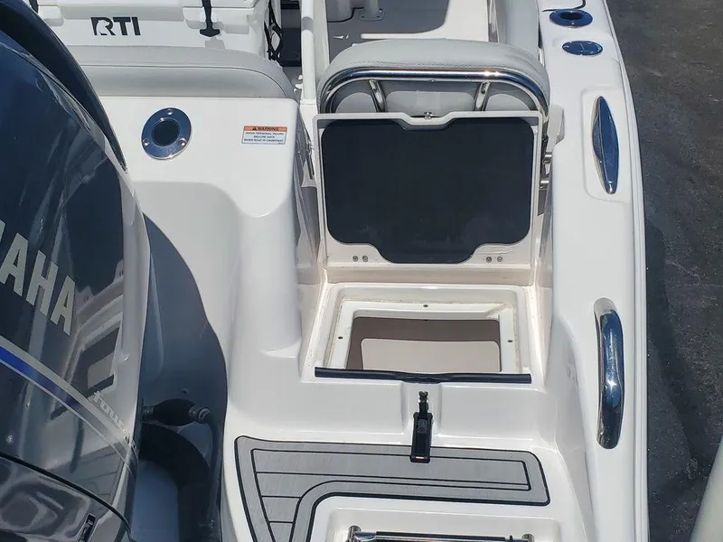 Slide: The Image of 2022 Sea Fox 268 Commander boat interior with Yamaha engine and storage compartment. - 34