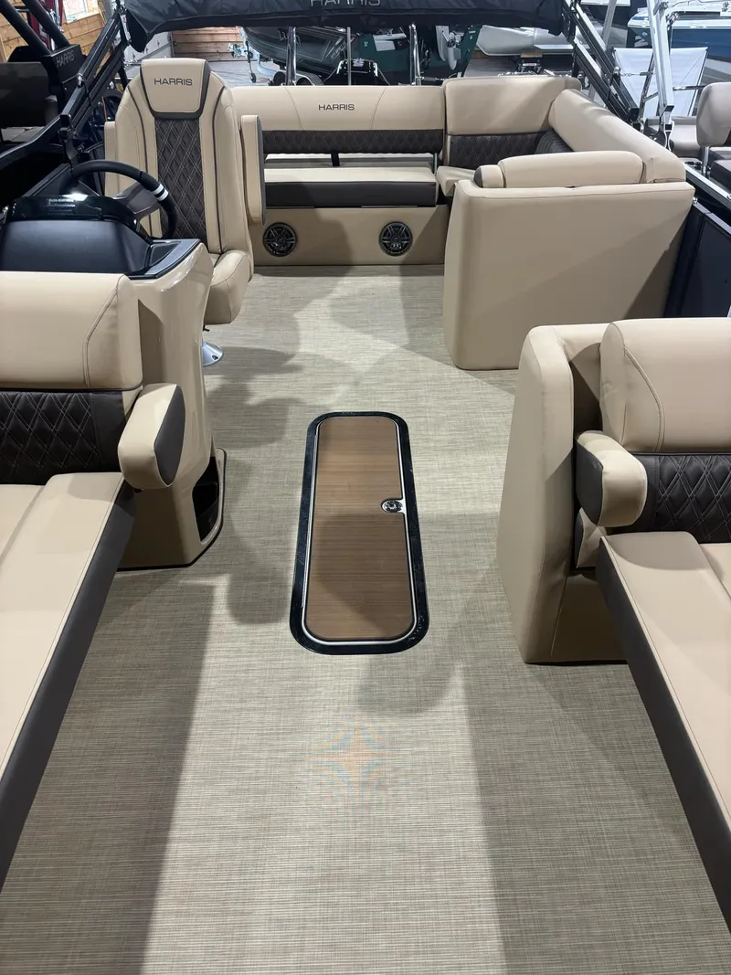 Slide: The Image of 2025 Harris Sunliner 230 SL interior with beige seating and modern design. - 4
