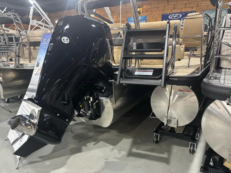 Slide: The Image of 2025 Harris Sunliner 230 SL pontoon boat with powerful outboard motor and sleek design. - 9
