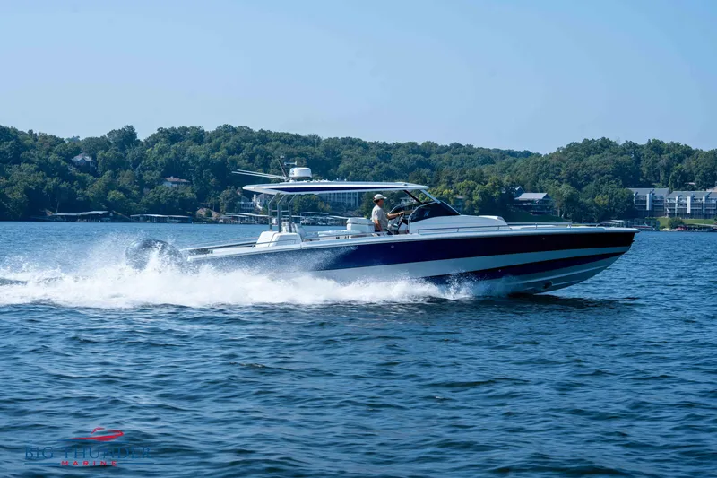 Slide: The Image of 2024 Opus 12 boat cruising on a lake. - 10