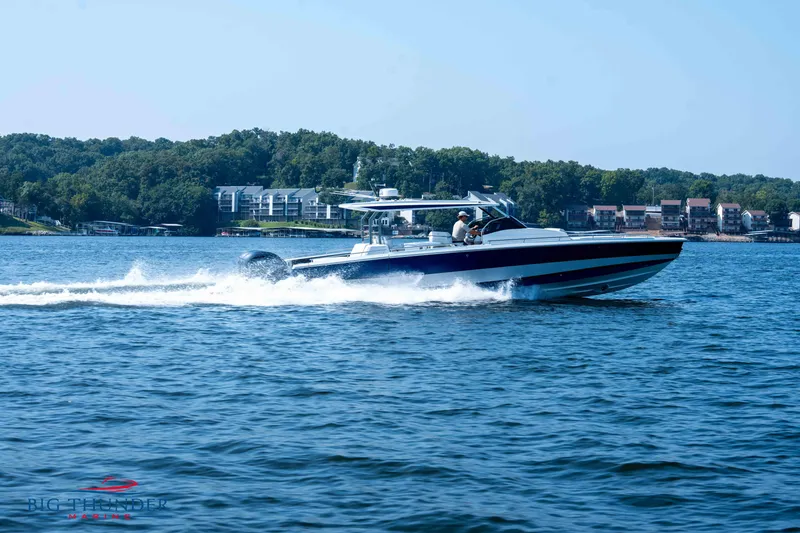 Slide: The Image of Opus 12 boat 2024 cruising on a lake. - 12