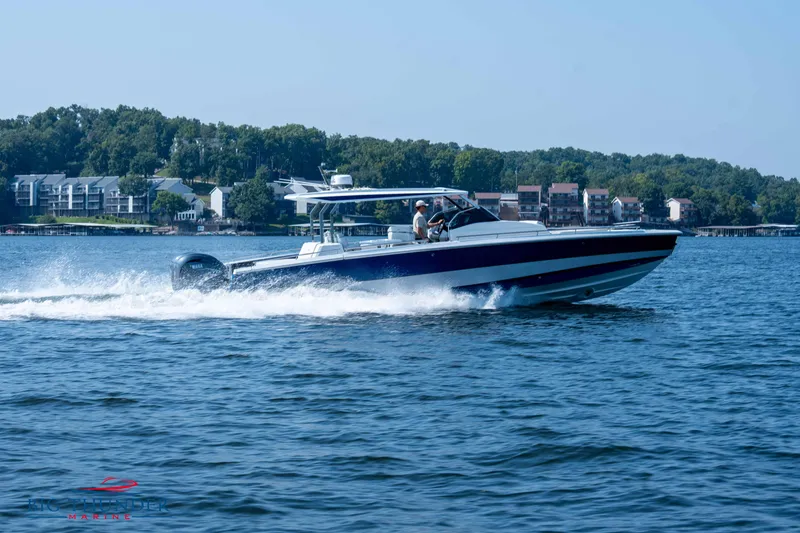 Slide: The Image of Opus 12 boat 2024 on a lake, surrounded by trees and buildings. - 13