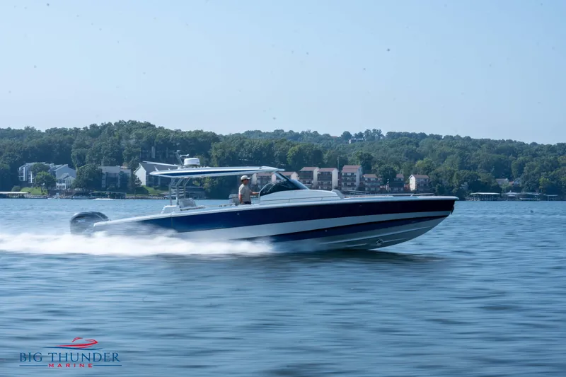 Slide: The Image of 2024 Opus 12 boat speeding on a lake. - 15