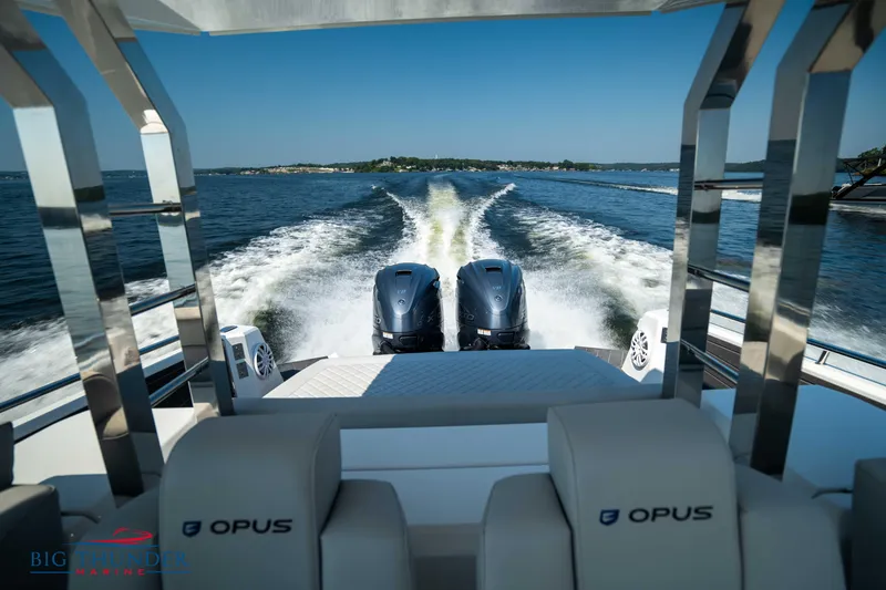 Slide: The Image of Opus 12 boat, 2024, with dual engines on water. - 29