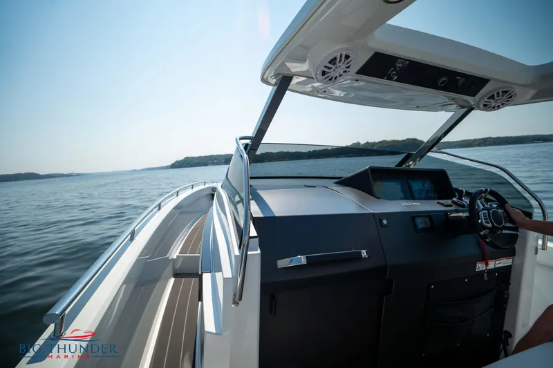Slide: The Image of Opus 12 boat 2024 on calm water with modern cockpit. - 30