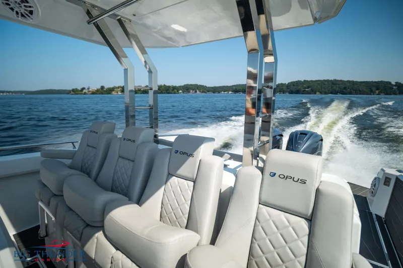 Slide: The Image of Luxurious interior of Opus 12 boat, 2024 model, on a lake. - 31