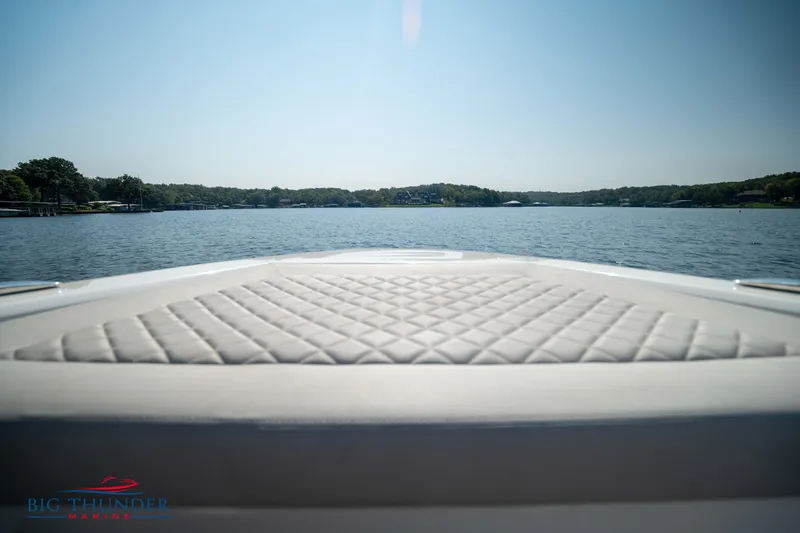 Slide: The Image of Opus 12 boat 2024 on calm lake with blue sky. - 34