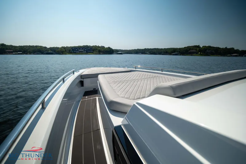 Slide: The Image of Opus 12 boat 2024 on a calm lake under sunny skies. - 35