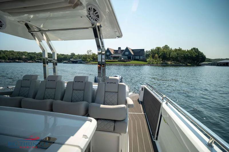 Slide: The Image of Luxurious Opus 12 boat on a serene lake, 2024 model. - 41