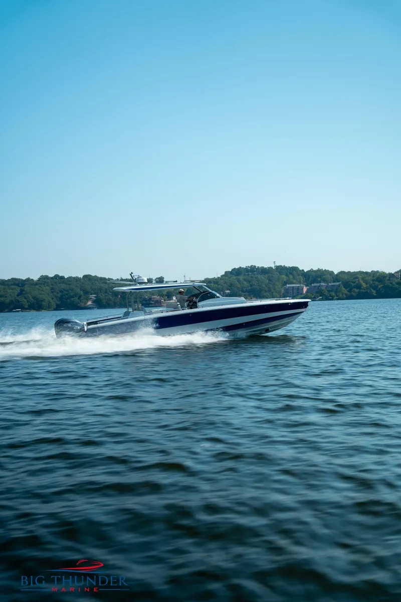 Slide: The Image of Opus 12 boat 2024 on a lake under clear sky. - 6