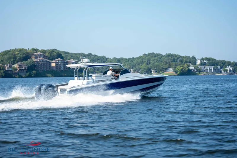 Slide: The Image of Opus 12 boat 2024 cruising on a lake under sunny skies. - 9