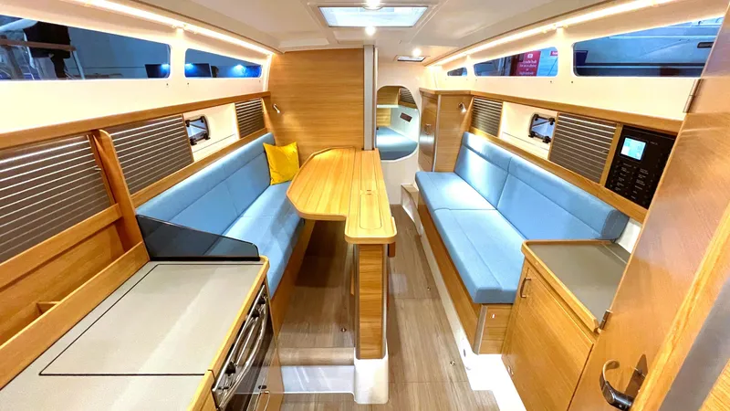 Slide: The Image of Luxurious interior of 2027 Dragonfly 36 sailboat with modern design and blue seating. - 10