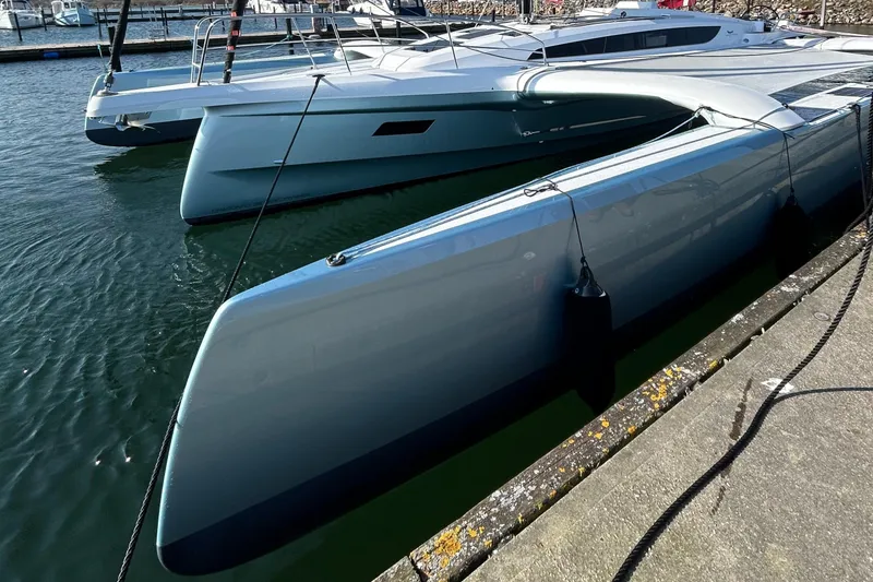 Slide: The Image of Modern Dragonfly 36 trimaran yacht docked in marina, 2027 model. - 5