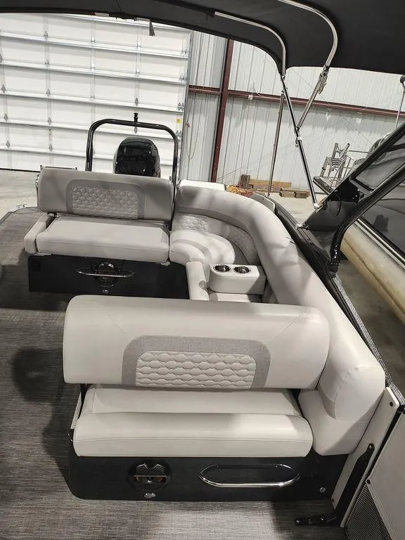 Slide: The Image of 2022 Crest 250SLS Savanna boat interior with plush seating and modern design. - 20