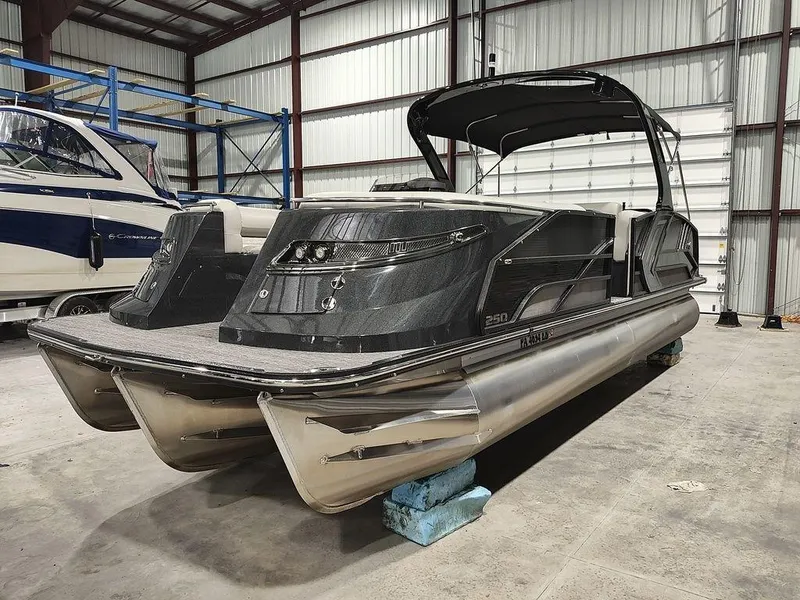 Slide: The Image of 2022 Crest 250SLS Savanna pontoon boat in a warehouse setting. - 4