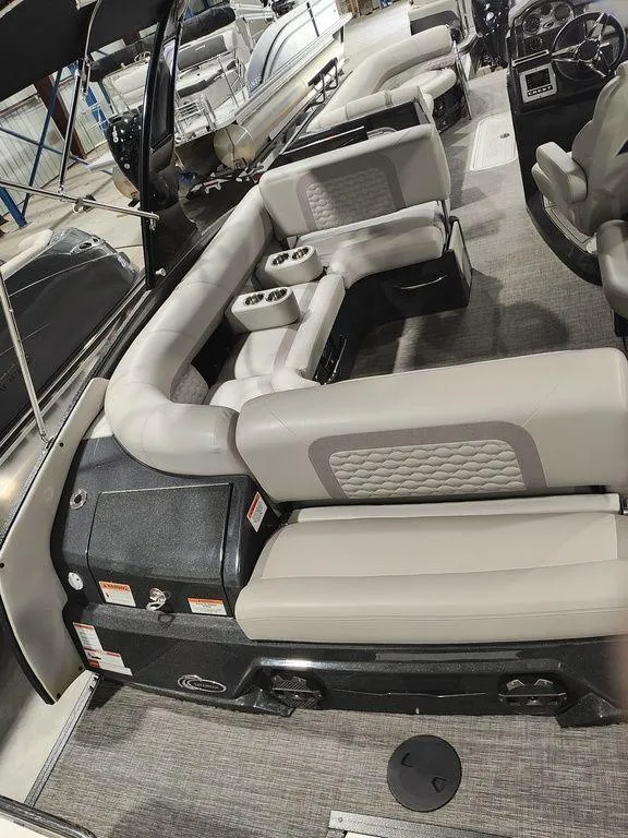 Slide: The Image of 2022 Crest 250SLS Savanna boat interior with plush seating and modern design. - 8