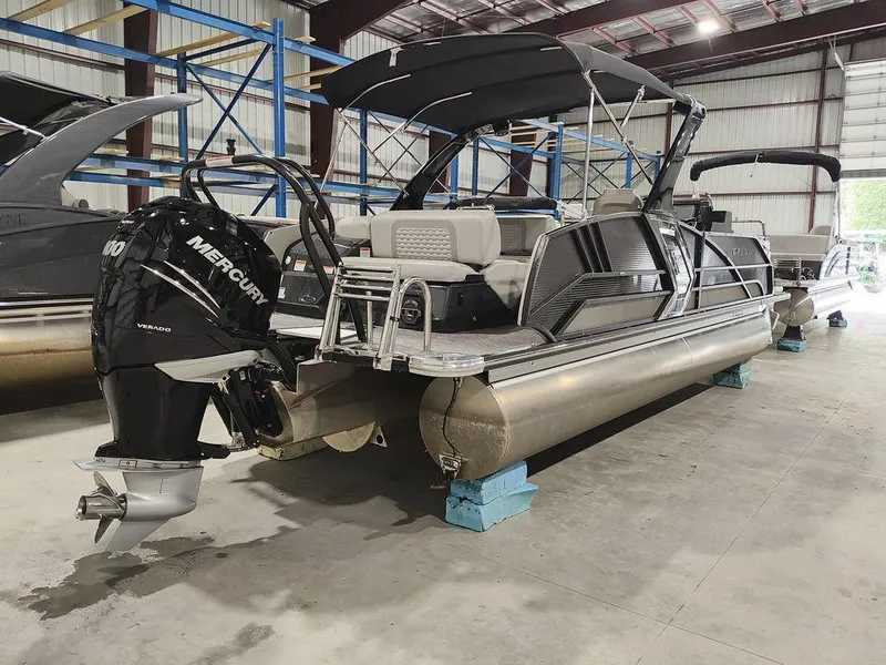 Slide: The Image of 2022 Crest 250SLS Savanna pontoon boat with Mercury engine in warehouse. - 9