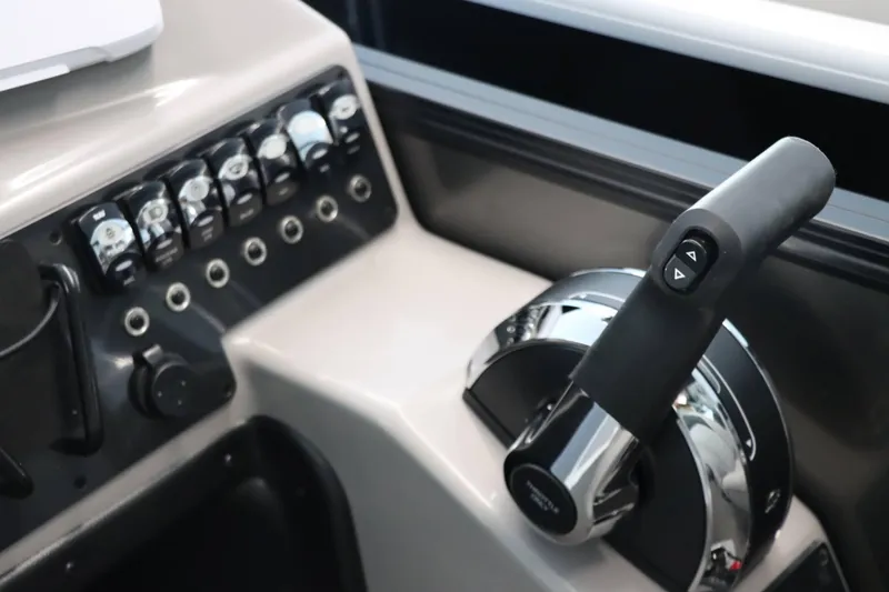 Slide: The Image of Control panel of 2025 Barletta ARIA 22QC boat with throttle and switches. - 16