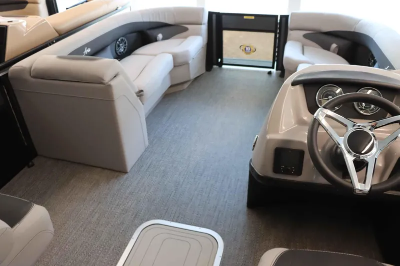 Slide: The Image of Interior of 2025 Barletta ARIA 22QC pontoon boat with plush seating and modern dashboard. - 8