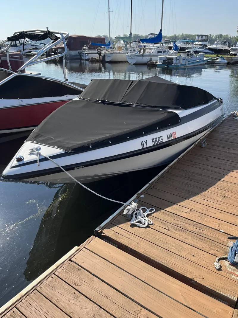 The Image of 2005 Crownline 180 BR boat docked at marina. - 0