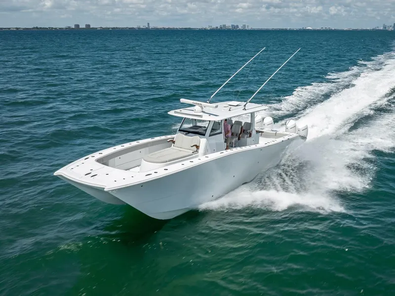 Slide: The Image of 2023 Freeman 43 boat cruising on open water, showcasing sleek design and performance. - 1