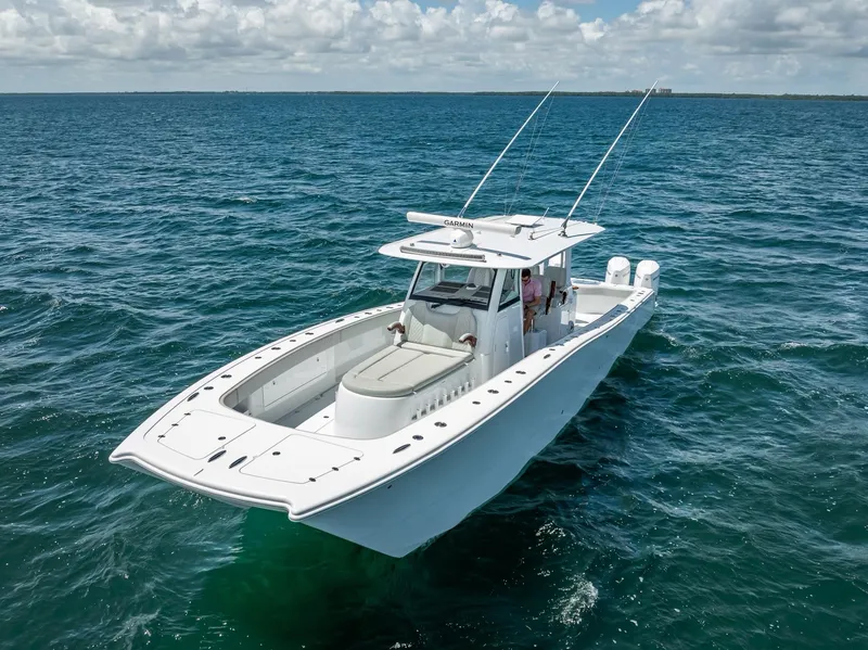 Slide: The Image of 2023 Freeman 43 boat cruising on open ocean under clear skies. - 10