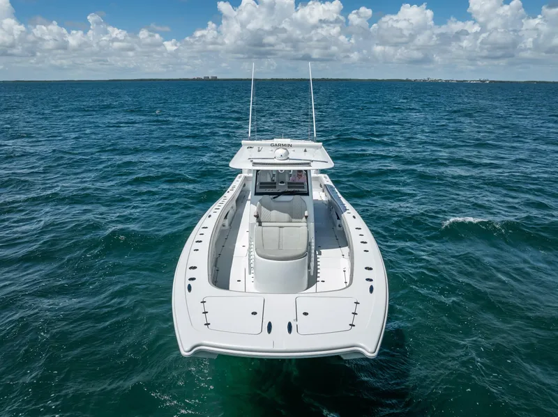 Slide: The Image of Freeman 43 boat on open sea, 2023 model, under clear blue sky. - 11