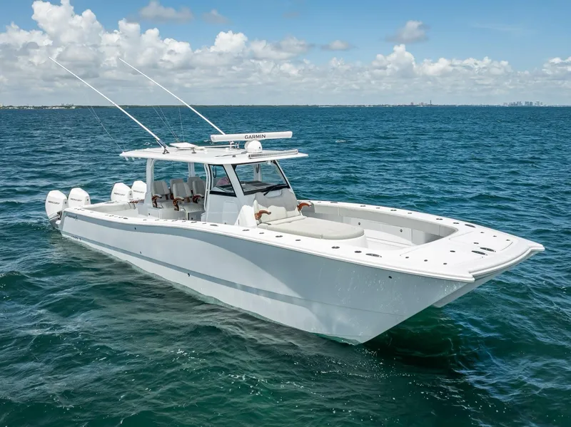 Slide: The Image of 2023 Freeman 43 boat cruising on open ocean under clear skies. - 13