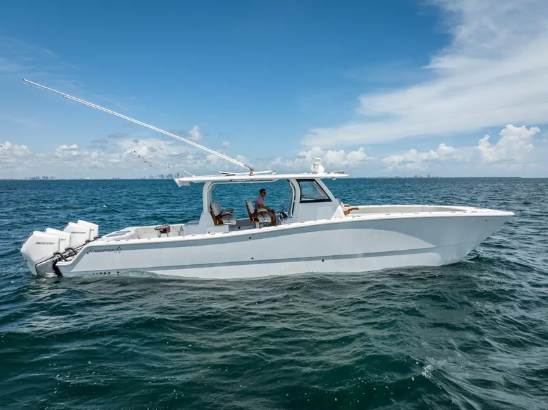 Slide: The Image of 2023 Freeman 43 boat on open sea under clear blue sky. - 15