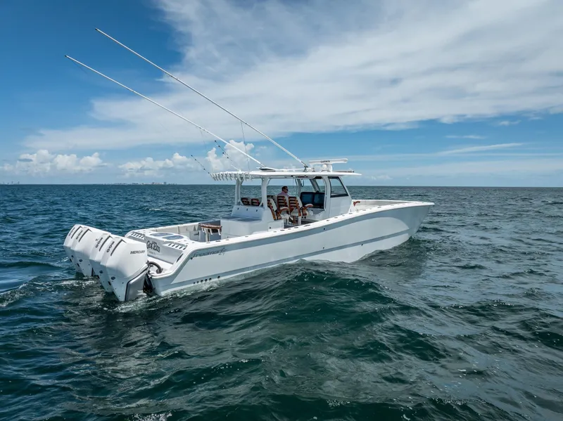 Slide: The Image of Freeman 43 boat cruising on open sea under clear blue sky, 2023 model. - 16