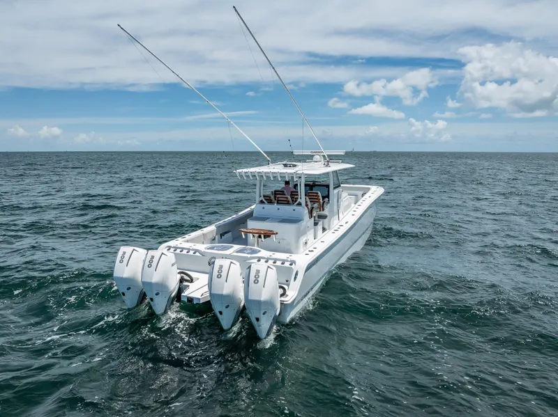 Slide: The Image of Freeman 43 boat with four engines cruising on open sea, 2023 model. - 18