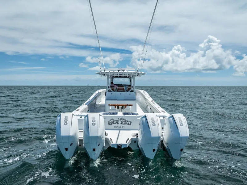 Slide: The Image of 2023 Freeman 43 boat with four engines on open sea under cloudy sky. - 19