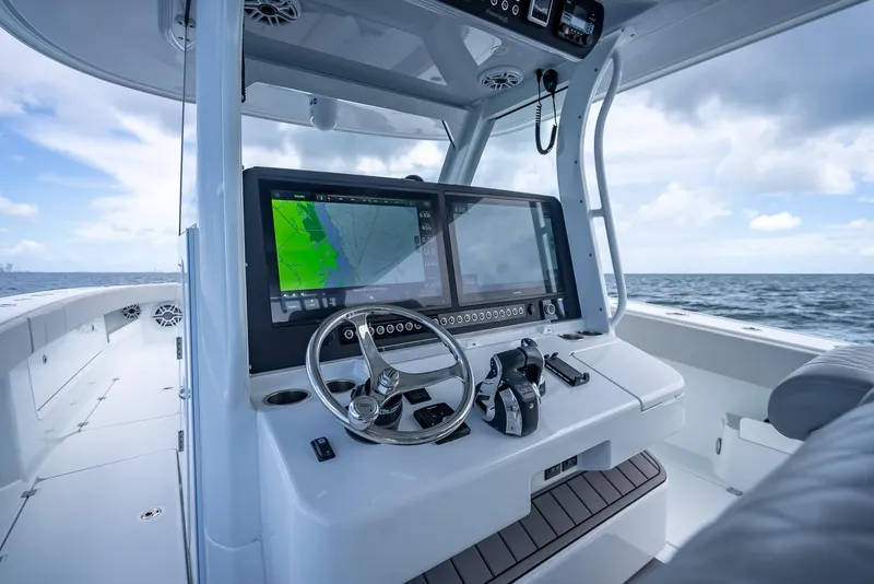 Slide: The Image of Freeman 43 boat cockpit with advanced navigation system, 2023 model, on open sea. - 23