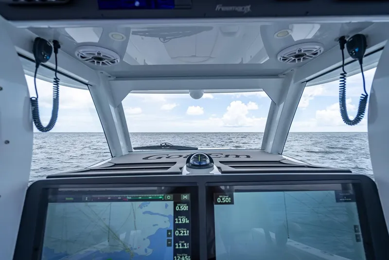 Slide: The Image of Freeman 43 boat interior with navigation screens, ocean view, 2023 model. - 24