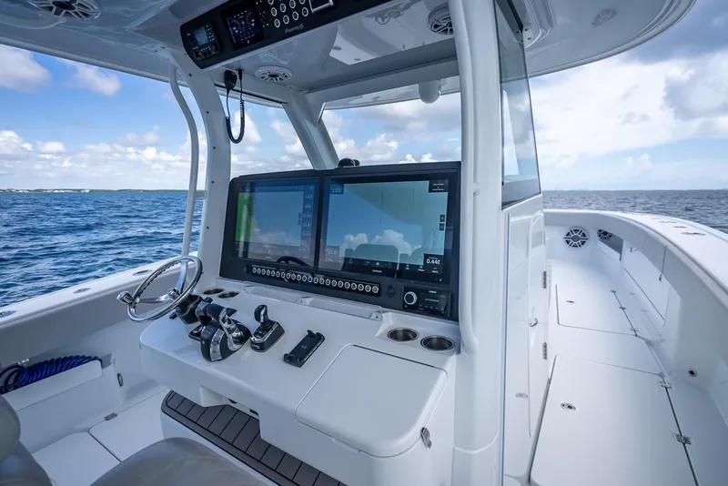 Slide: The Image of Freeman 43 boat cockpit with advanced navigation system, 2023 model, on open sea. - 25