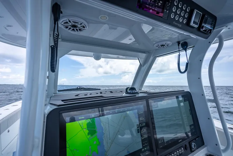 Slide: The Image of Freeman 43 boat cockpit with navigation screens, ocean view, 2023 model. - 26
