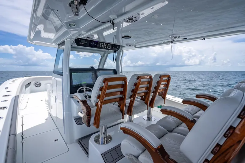 Slide: The Image of Luxurious 2023 Freeman 43 boat interior with wooden seats and ocean view. - 29