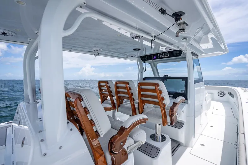Slide: The Image of Luxurious 2023 Freeman 43 boat interior with wooden seats and ocean view. - 30