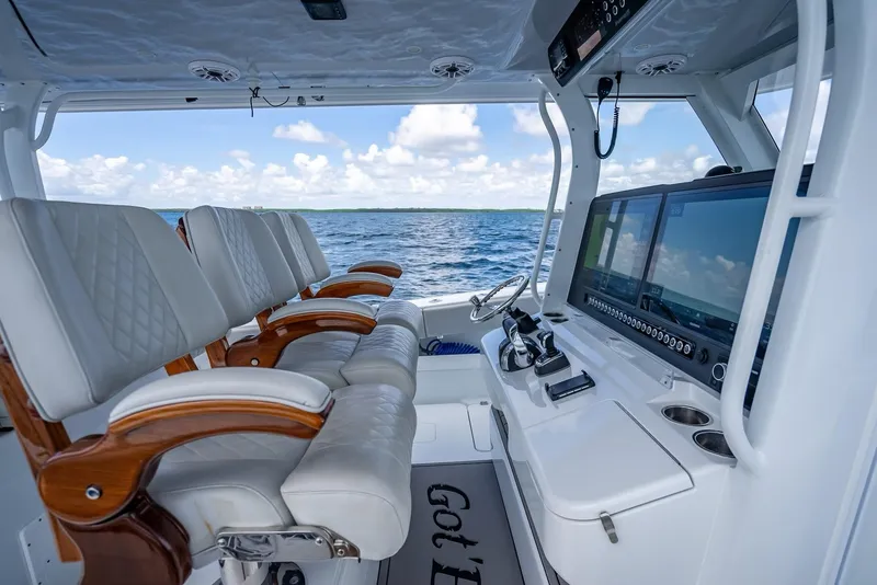 Slide: The Image of Freeman 43 boat interior with luxurious seating and advanced navigation system, 2023 model. - 32