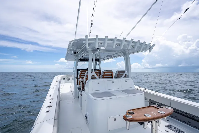 Slide: The Image of Freeman 43 boat, 2023 model, cruising on open sea under cloudy sky. - 36