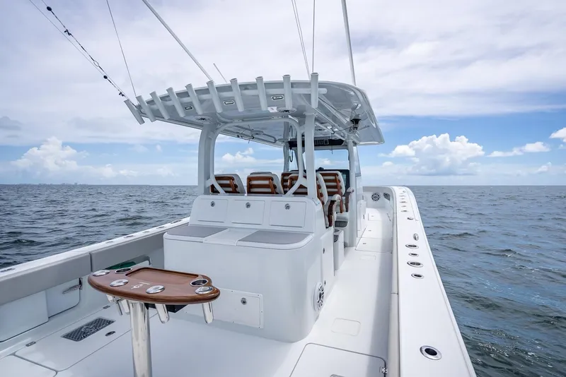 Slide: The Image of 2023 Freeman 43 boat on open water, featuring spacious deck and seating. - 37