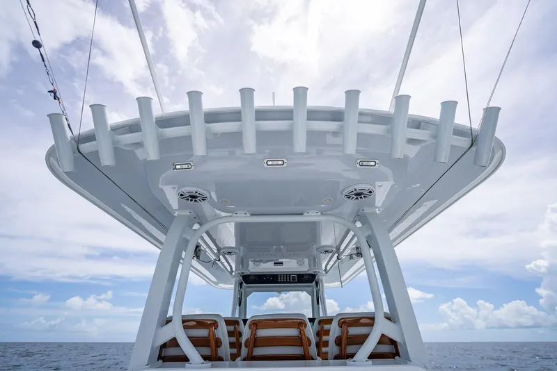 Slide: The Image of Freeman 43 boat, 2023 model, featuring sleek design and spacious seating under a clear sky. - 42