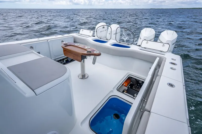 Slide: The Image of Freeman 43 boat deck with seating, fishing amenities, and ocean view, 2023 model. - 45