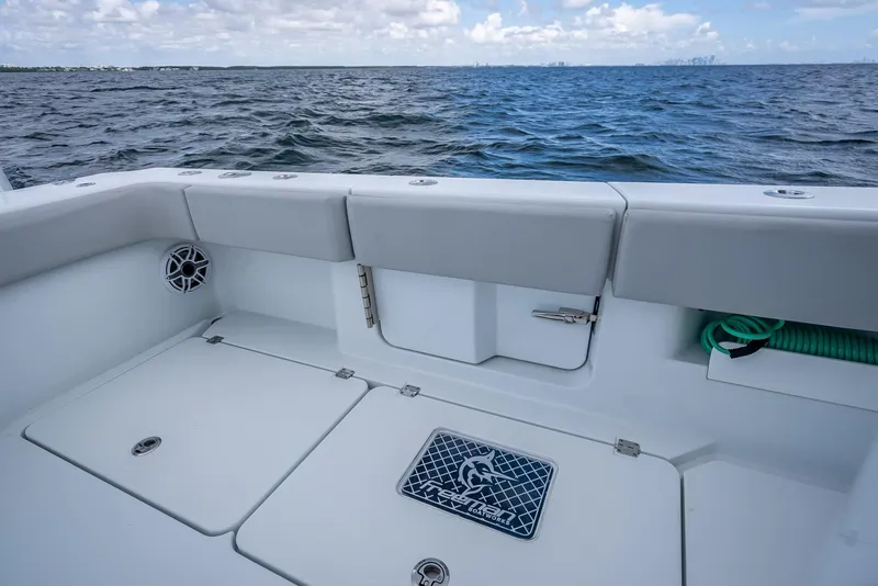 Slide: The Image of Freeman 43 boat deck overlooking ocean, 2023 model, with storage compartments and seating. - 47